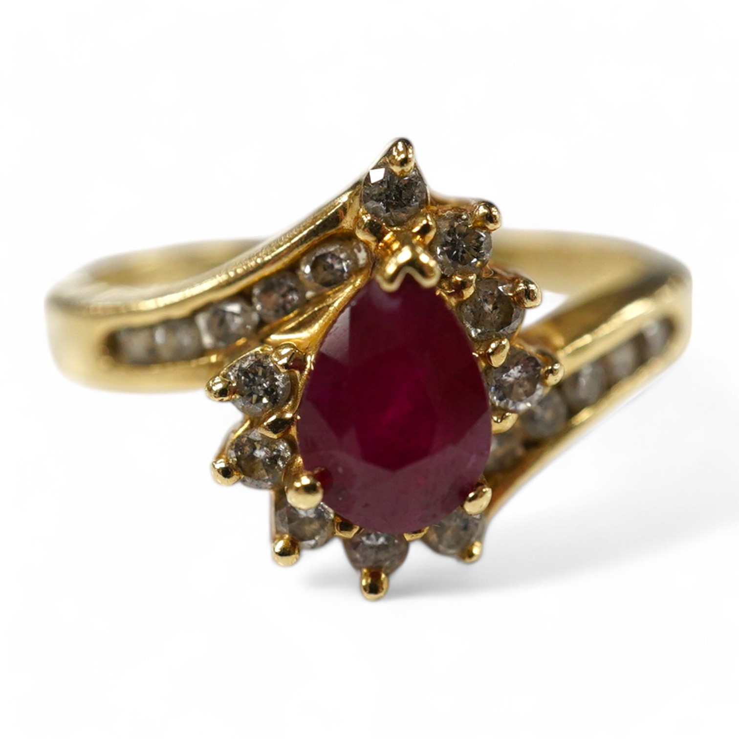 A recent 14k, ruby and diamond cluster set dress ring, size O, gross weight 3.4 grams. Condition - fair to good